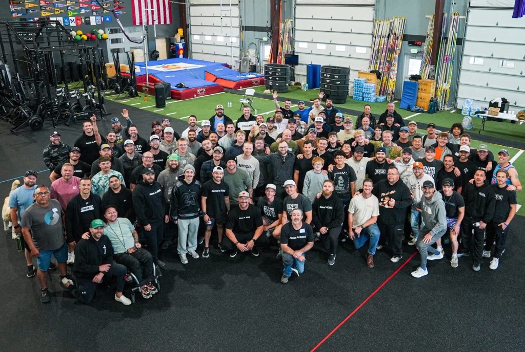 Group photo of dozens of men smiling together after the April 2026 Colorado Launching Pad event