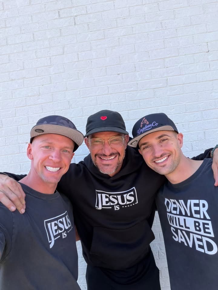 Three brothers smiling in Jesus Is and Denver Will Be Saved gear against a white wall